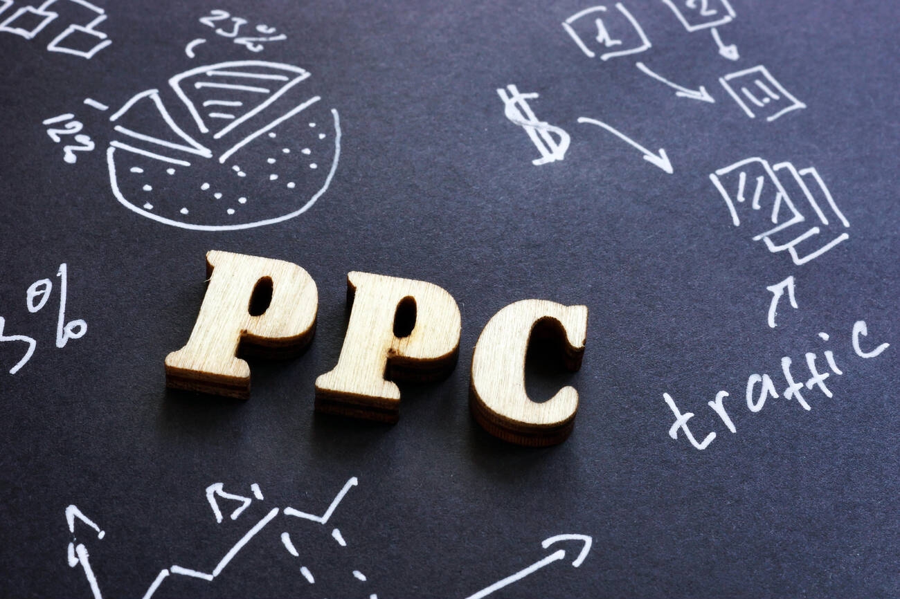 ppc-pay-per-click-sign-on-black-paper
